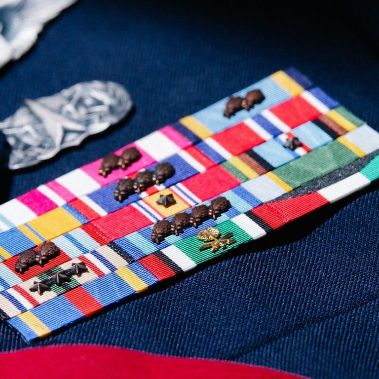 A collection of colorful fabric pieces and small ornamental figures arranged on a surface.